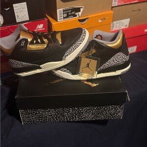 Jordan Black and Gold Athletic Shoes with Iconic Design